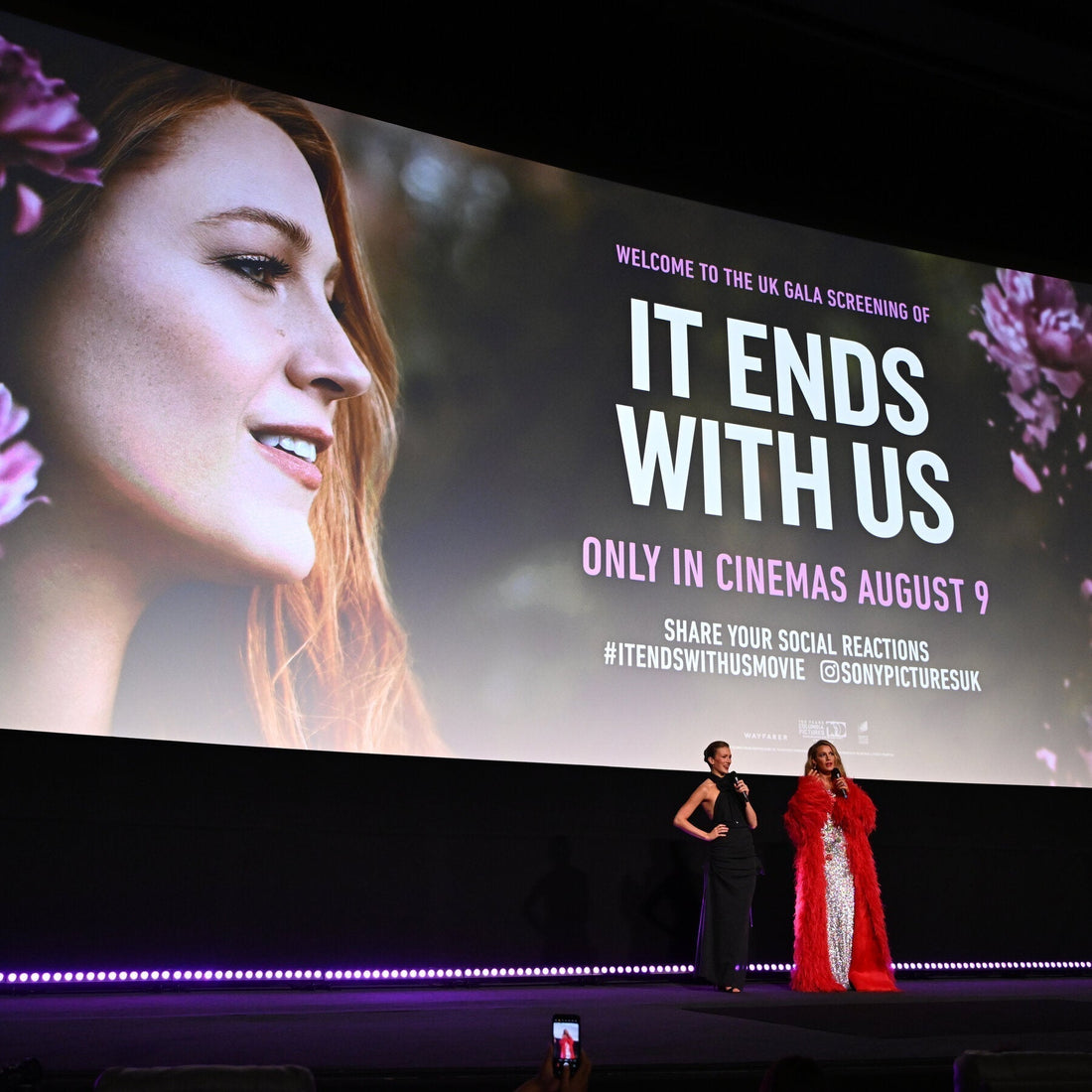 UK film screening event for 'It Ends With Us' with actors on stage in front of movie poster