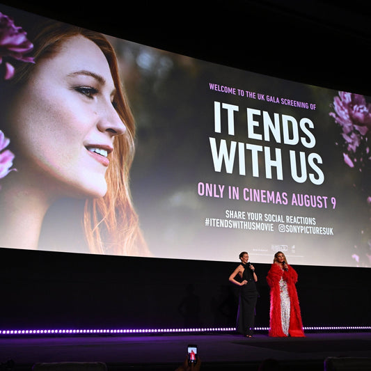 UK film screening event for 'It Ends With Us' with actors on stage in front of movie poster