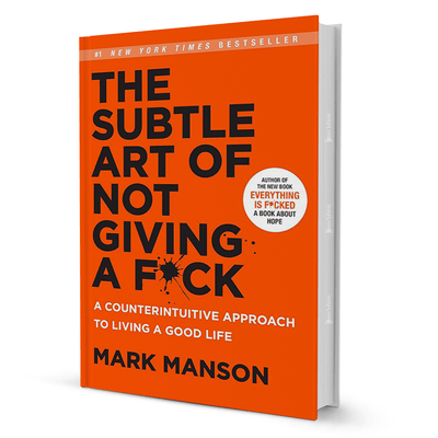 The Subtle Art of Not Giving a F*ck self-help book by Mark Manson with bold orange cover
